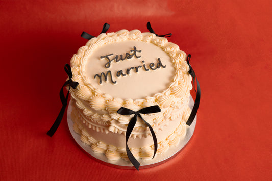 Black Bows Just Married Wedding Cake