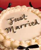 Black Bows Just Married Wedding Cake