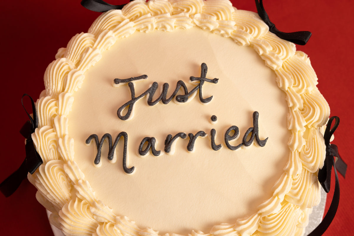 Black Bows Just Married Wedding Cake
